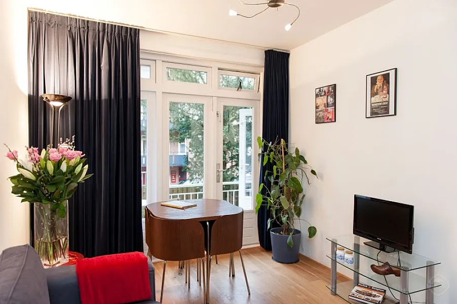 Dining Area Overview with Plasma TV West City apartment Amsterdam